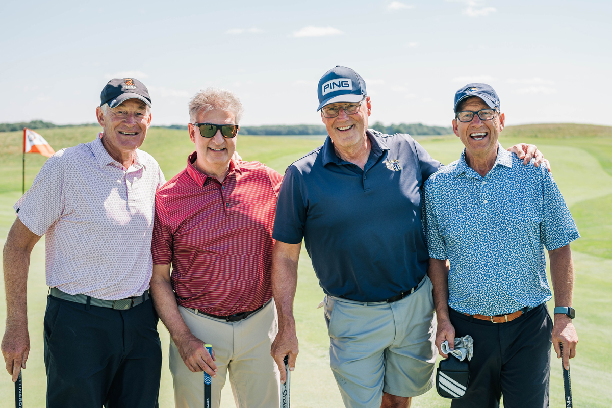 Participants smiling and posing for a group photo.